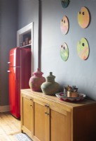 Colourful artwork and ornaments in modern kitchen