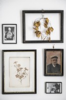 Detail of framed pictures on wall