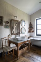 Old wooden table with sink in country bathroom