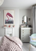 Flamingo painting on wall of modern bedroom