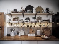 Kitchen shelves with plates, glasses and cups