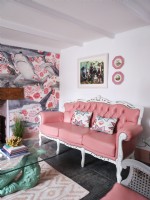 Coastal themed living room with pink furniture 
