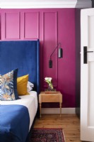 Bedroom with pink wall panelling