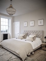 Soft bed furnishings in muted tones 
