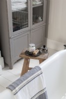 Bathroom detail, perfume, bath salts, stool table