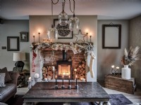 Rustic living room featuring decorative mantel and fireplace