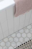 Close up of white and marble tiles