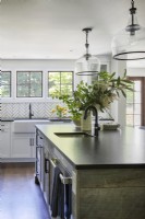 Modern kitchen island with soft granite top.