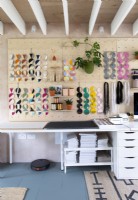 Display of modern fabric wall hangings in workshop