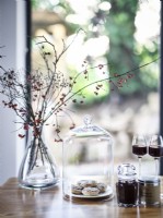 Retro flower and glassware arrangement on dining table