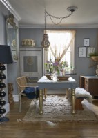 View of a eclectic dining room from an open plan living room. 