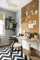 Home office with cork wall.
