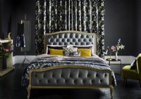 Ornate bed with patterned curtains