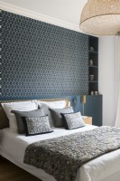 Feature wall behind bed in modern bedroom
