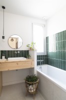 Modern bathroom with green splashback tiling