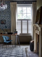 Home office with shutters and curtains