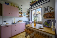 Pink kitchen with a kitchen island