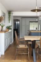 Open plan grey and blue shaker style kitchen dining room