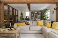 Spacious country living room with exposed wood beams