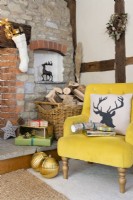 Corner of a living room with yellow armchair and wrapped Christmas presents