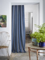 Blue patterned curtain in doorway