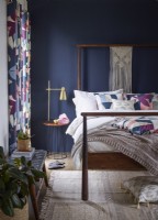 Blue bedroom with patterned wallpaper