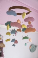 Colourful fabric cloud mobile in childrens room - detail