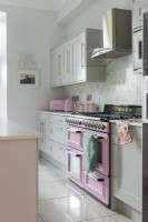 Pink oven and accessories in modern kitchen