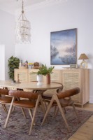Dining room with modern sideboard, table and leather chairs