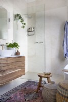 Bathroom with shower and wooden vanity