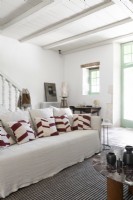 White sofa covered in cushions in modern country living room