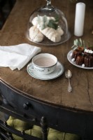 Detail of classic dining table with tea and cakes