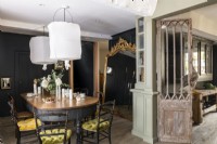 Distressed wooden internal door in classic style dining room