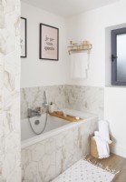Bathroom with hexagonal marble effect tiles.
