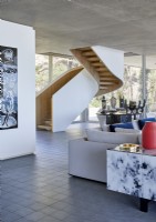Staircase in centre of contemporary open plan living room
