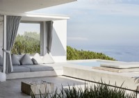 Outdoor living area with sofa and swimming pool