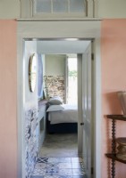 View through doorway to country bedroom