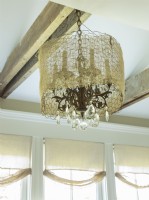Airy netting adds a touch of whimsy to a classic chandelier.