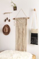 MacramÃ© is a common thread throughout Kateâ€™s decor; inexpensive and relatively simple to make by knotting string in patterns, it fills walls with an organic, homespun quality
