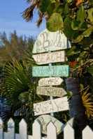 Handmade signs welcome friends to the waterside property.