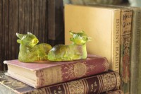 The quirky green glass â€œsacred cowâ€ paperweights were market treasures found on a trip to India. 