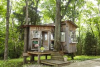 At just 100 square-feet, this Nashville tree house is a tiny escape from urban life and adulthood. Only a few feet off the ground, itâ€™s easy to access without any tree-climbing skills.
