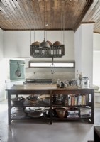 Large wooden island in country kitchen