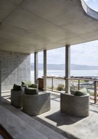 Concrete built-in seating on modern balcony with sea views