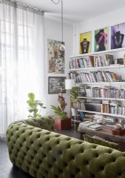 Green studded sofa in modern living room