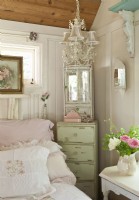A narrow and tall vintage dresser fits nicely next to the bed, offers pretty storage and doubles as a nightstand.