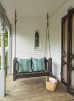 The front porch features original Victorian gingerbread trim.
