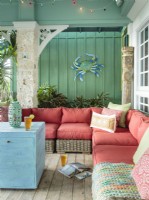 Inside room and outdoor spaces are decorated an identical color palette The original corbel came from the Barnum and Bailey mansion in Sarasota, Florida. 