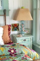 Soft hues get a boost from a colorful duvet.