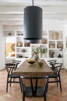 Large pendant lights over table in modern country dining room